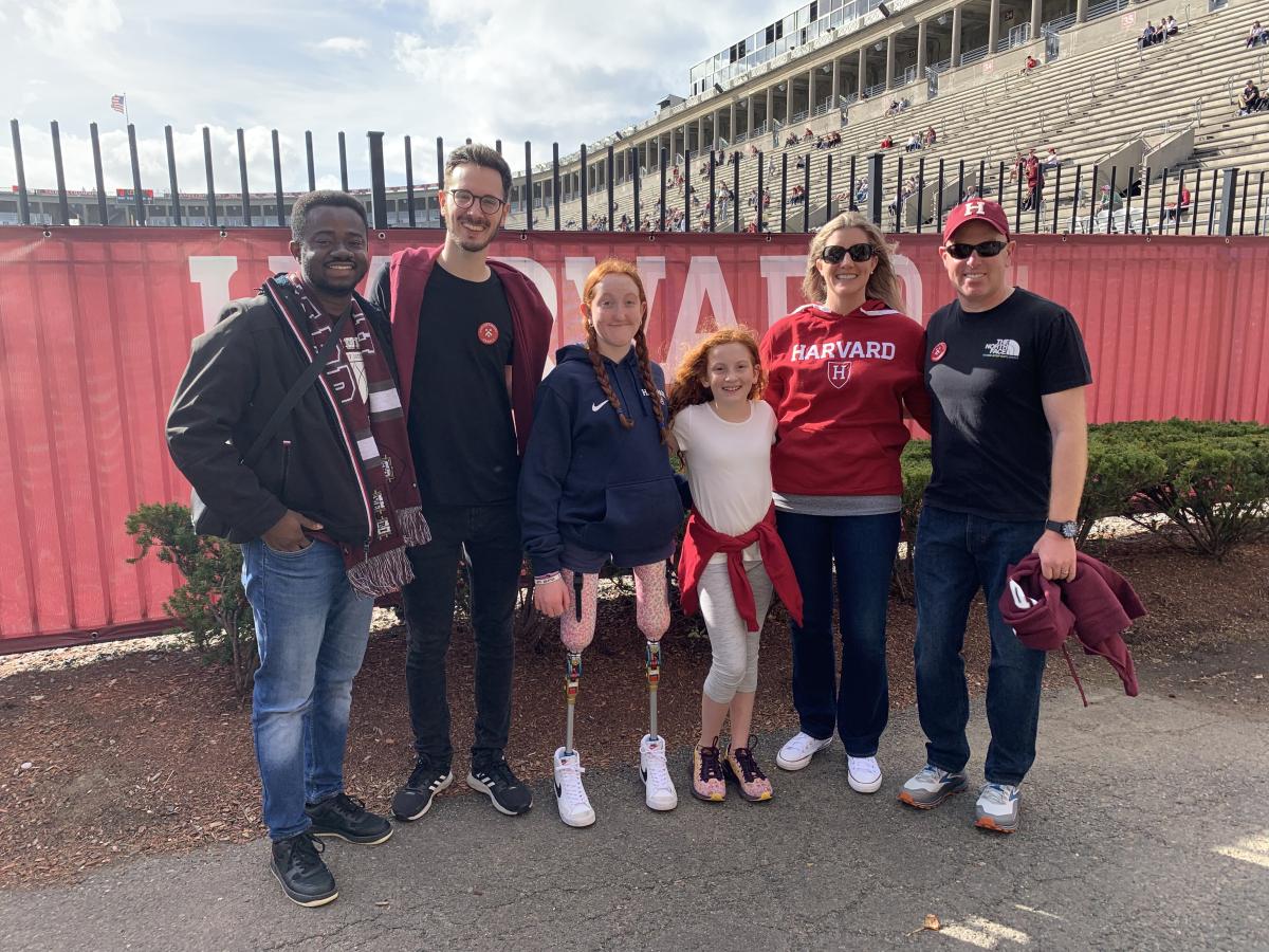 Students and host family at Harvard football game